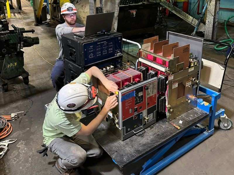 how to repair circuit breaker issues 3 technicians testing circuit breaker in industrial facility
