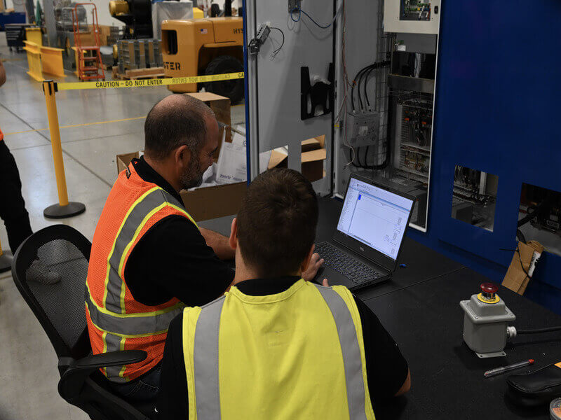 technicians working together during the commissioning process