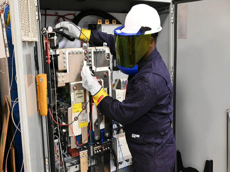 technician working on emergency power services system