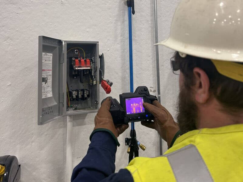 ir-scan-review engineer performing ir scans on electrical equipment