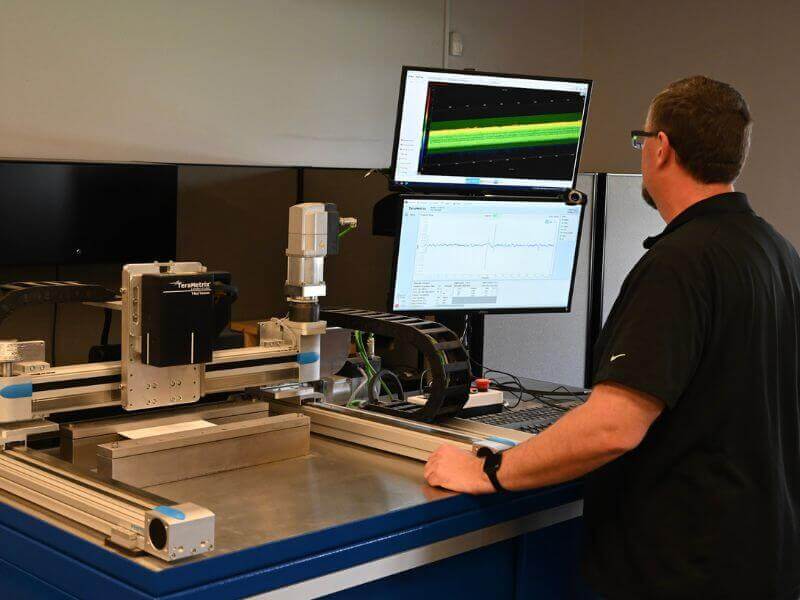 engineer analyzing data from the gauging system setup