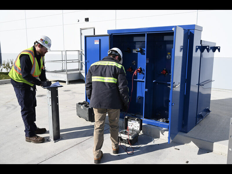 technicians inspecting gear for neta certified companies