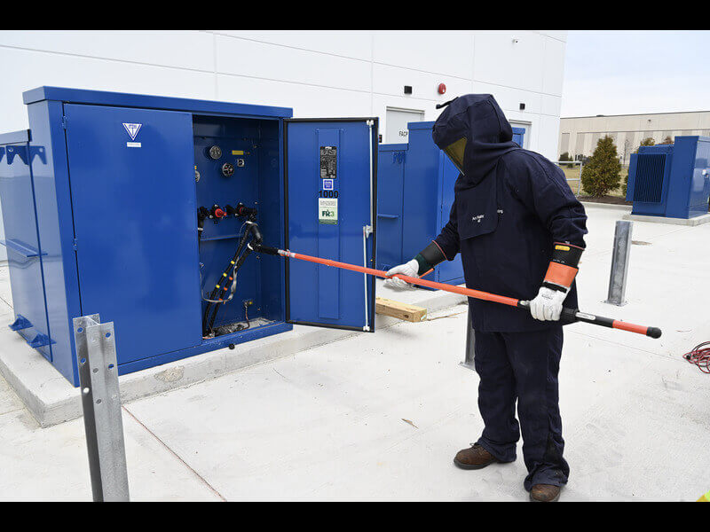 technician in ppe testing gear for neta certified companies