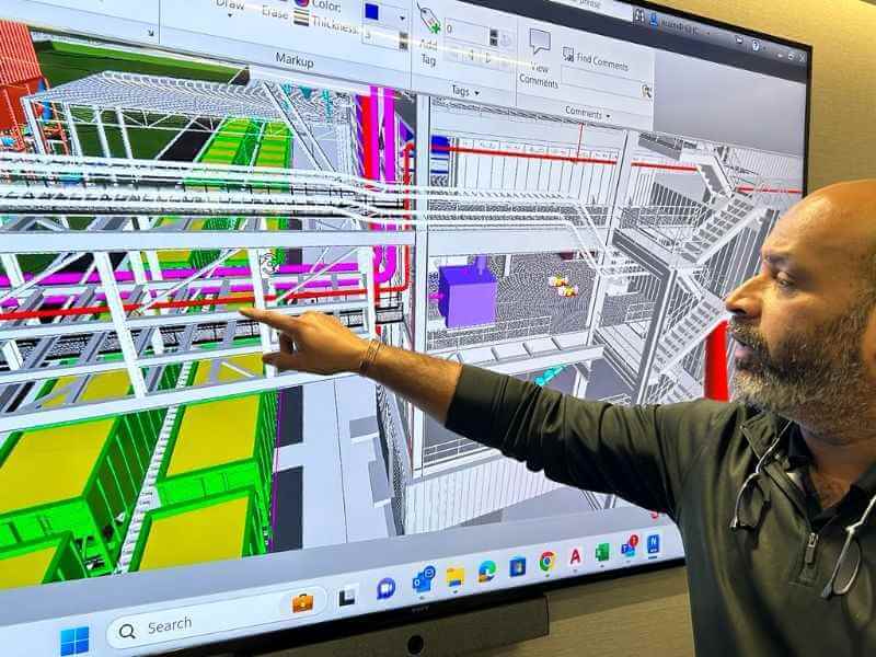 professional engineering company staff reviewing 3d model