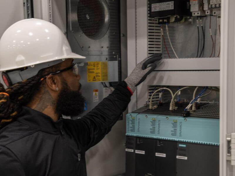 wisconsin automation integrators inspecting control panel