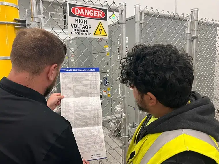 engineers reviewing the preventive maintenance services schedule