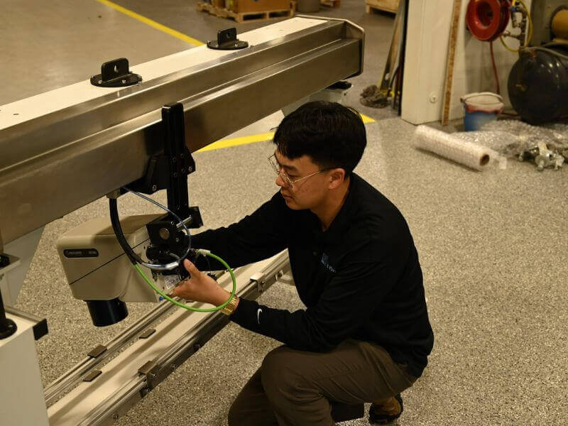 technician setting up a standard gauging system