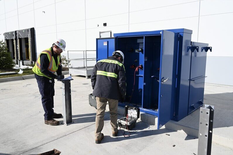 technicians monitoring electrical cable testing standards