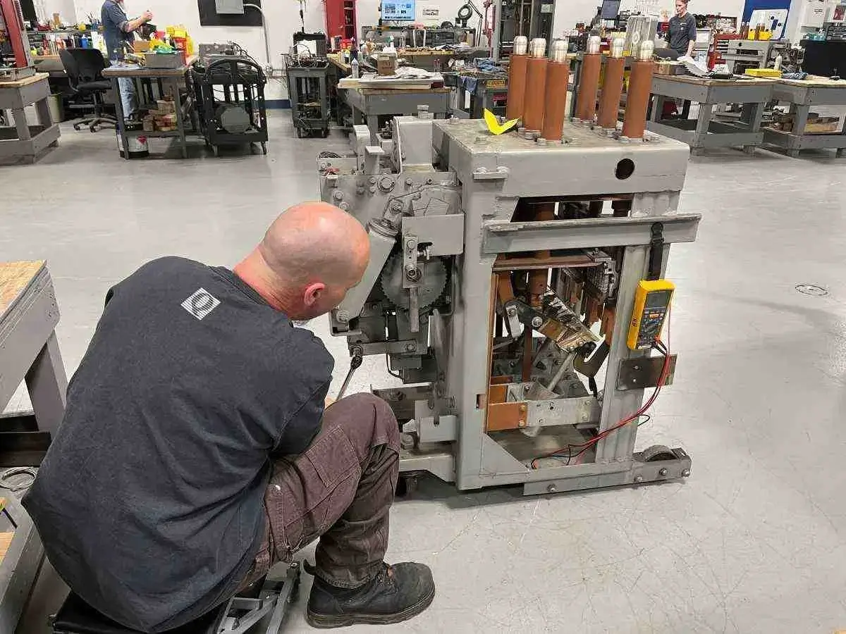 vacuum circuit breaker testing tips for electrical safety 3 technician inspecting a vacuum circuit breaker